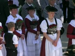 MS Pilgrimage of societies for traditional costumes at abbey Maria Eck near Siegsdorf, Chiemgauer Alps / Siegsdorf, Bavaria, Germany Stock Footage