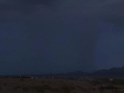 Bright lightning bolt strikes under desert thunderstorm near Tucson Arizona, USA. Stock Footage