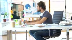 Graphic designer working at the office Stock Footage