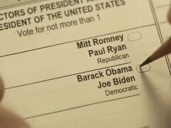 XCU of voter using pencil to mark presidential ballot for Barack Obama Stock Footage