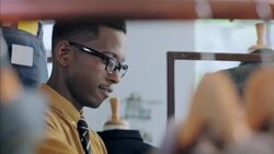 Modern shop worker counts stock and enters numbers on tablet in clothing store Stock Footage