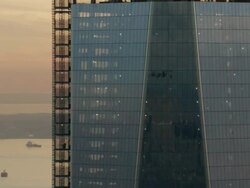 tight circling aerial shot of One World Trade Center at sunset Stock Footage
