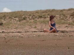 (HD1080i) Beach Yoga: Sideways Twists and Stretches Stock Footage