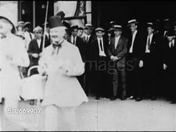 1920s: VAUDEVILLE: GALLAGHER & SHEEN: Ed Gallagher & Al Sheen leaving theatre in costume, people standing BG, car pulling up to curb, both getting into car, crowd of people watching BG. (Note: Al Sheen Marx brothers uncle) Instructional Video