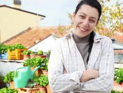 Successful young female gardener on her roof garden Stock Footage
