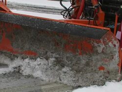 Winter service - City Plow scraping the road Stock Footage