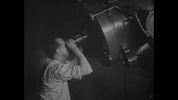 Man with telescope at observatory in 1930s News Clip
