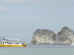 WS View of Excursion boats and Limestone rock in Sea, Marine National Park / Ko Hai, Krabi, Thailand Stock Footage