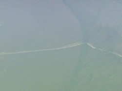 "Camera zooms out from jeep driving down road to show mountain road cutting through the mountain side, Leimebamba [Leymebamba] Valley, Peru" Stock Footage