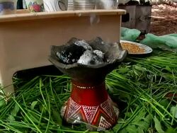 Woman setting down incense for coffee ceremony Stock Footage