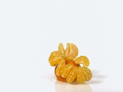 CU SLO MO Shot of Clementines, citrus reticulata, Fruits falling and splashing on Water against White Background / Calvados, Normandy, France Stock Footage