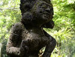  MS Stone carved god like figure in tropical garden / Ubud, Bali, Indonesia Stock Footage