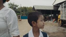 M/S STEADYCAM Myanmar boy and mother going to the school bus Stock Footage