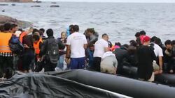 Syrian migrants fleeing the war and escaping to Europe, landing on the Greek island of Lesvos on the north coast at Efthalou. Up to 4,000 migrants a day are landing on the island and overwhelming the authorities. They are traficked by illegal Turkish peopl Stock Footage