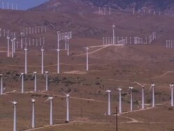Aerial TS LA of wind farm in desert / Tehachapi Pass, California, United States. Stock Footage