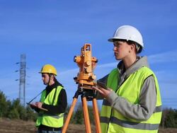 Land surveyors on construction site Stock Footage