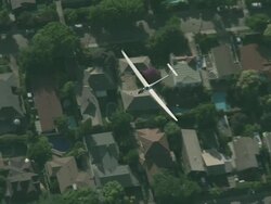 January 1, 2010 AERIAL Glider flying over the foothills and forested area of Andes Mountains / Santiago de Chile, Gran Santiago, Chile Stock Footage