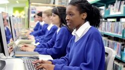 Students studying in school computer lab Stock Footage