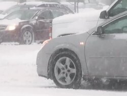 Winter snowstorm. Car traffic on slippery road. Stock Footage