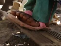 Girl's feet working sewing machine pedal Stock Footage