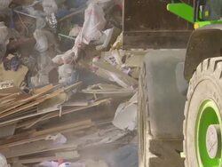 Excavator Moving Pile of Waste CU Stock Footage