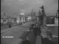 1938: PRAGUE, CZECHOSLOVAKIA: CU 'Alcron, Praha' travel sticker. LS People walking on Charles Bridge. XHA Cityscape. XHA WS Cityscape w/ trams moving on street, Municipal House (Art Nouveau) building & dome in Old Town. Czech Republic. Instructional Video