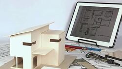 Architect working with house model & blueprints Stock Footage