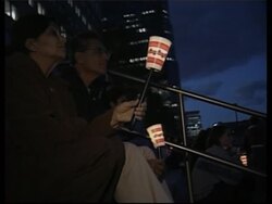 Tribute in light' on World Trade Centre site, people lighting candles News Clip
