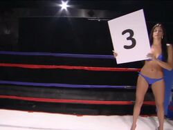 CU ZO WS PAN Trainer pouring water into boxer's mouth while woman walks around boxing ring with Round 3 sign / Jacksonville, Florida, USA Stock Footage