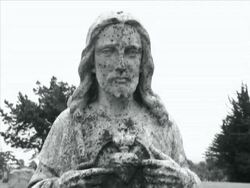 Jesus Statue in Cemetery Stock Footage