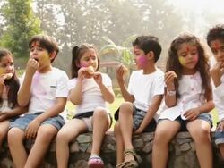 Group of kids eating gujia in holi festivals Stock Footage