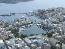 WS AERIAL DS View over buildings in down town and bay / Agios Nikolaos, Crete, Greece Stock Footage