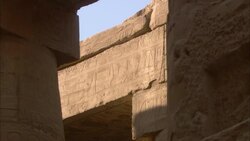 The ruinous walls of the Karnak Temple frame a square of blue sky. Stock Footage