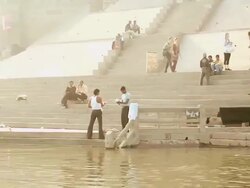 MS POV View of boats with people at ghats near Ganges River / Varanasi, Uttar Pradesh, India Stock Footage