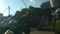 Riot police and protesters during G20 in Hamburg News Clip
