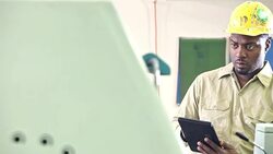 Man operating printing press, setting controls Stock Footage