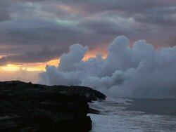 WS Steam plume rising from volcanic vent by sea at dawn / Kalapana, Hawaii, USA Stock Footage