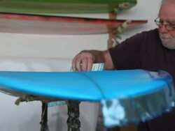 "Craftsman fabricates new surfboard in shop, using resin" Stock Footage