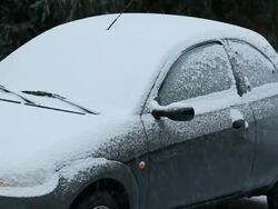 MS Snow covering car during winter snowfall / Saarburg, Rhineland-Palatinate, Germany Stock Footage