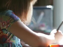Little Girl Coloring a Picture Stock Footage
