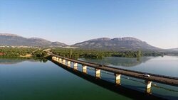Concrete Truss Road birdge over Hartebeestpoort Dam, Gauteng, South Africa Stock Footage