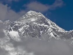 Panning shot of Time-lapse of clouds swirling around Mount Everest. Stock Footage