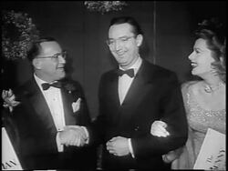 B/W 1955 Benny Goodman shaking hands with Steve Allen at premiere of "The Benny Goodman Story" / news. Stock Footage