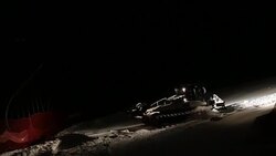 Machine for leveling the ski slopes works at night. Stock Footage