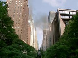 Long Shot static - The Chrysler Building crumbles behind thriving sidewalk trees in a computer-generated animation. / New York City, New York, USA Stock Footage
