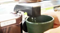 metal tap,water and cup Stock Footage