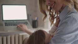 4K: Mother working and breastfeed her baby in office. Stock Footage