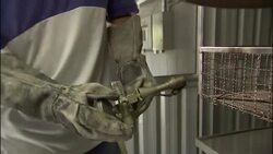 Men use propane to ignite a furnace. Stock Footage