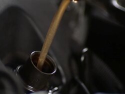 CU SLO MO Mechanic pouring oil into engine / Bergenfield, , New Jersey, USA    Stock Footage