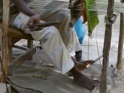 MS TU Man weaving / Togo Stock Footage